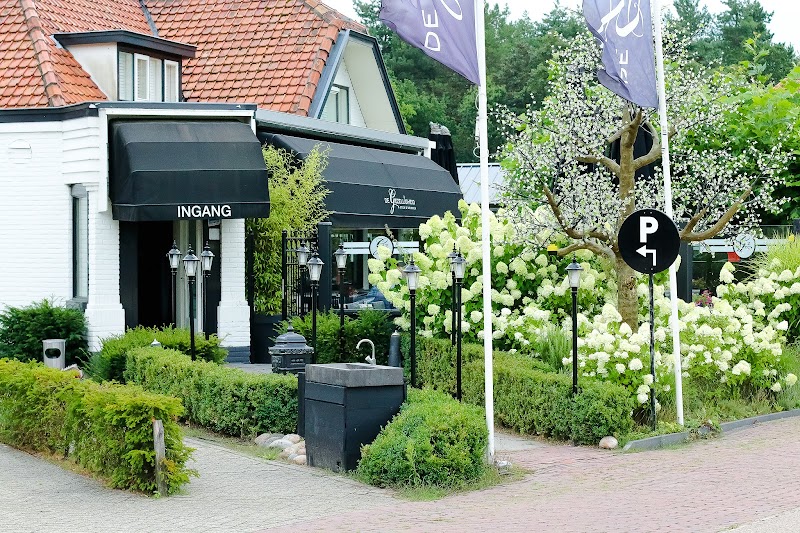 The charming exterior entrance of Restaurant De Gezelligheid in Leusden